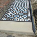 York stone on the front part of a Victorian tiled pathway in London